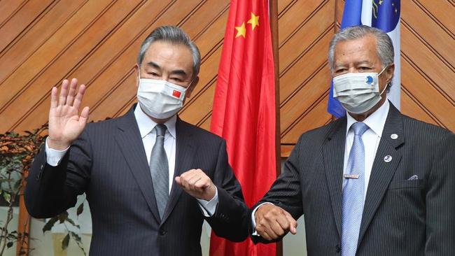 China Foreign Minister Wang Yi with Henry Puna, Secretary-general of the Pacific Islands Forum. Picture: ABC News.