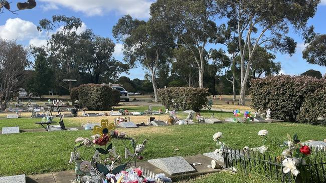 Graves with flowers and colourful toys at the Garden of Little Angels at Altona Memorial Park. Photo: Nilsson Jones