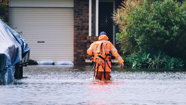 Local SES members were invaluable in the recent floods, seen here at West Ballina doorknocking residents on Monday March 30, 2022. Picture: Tessa Flemming.