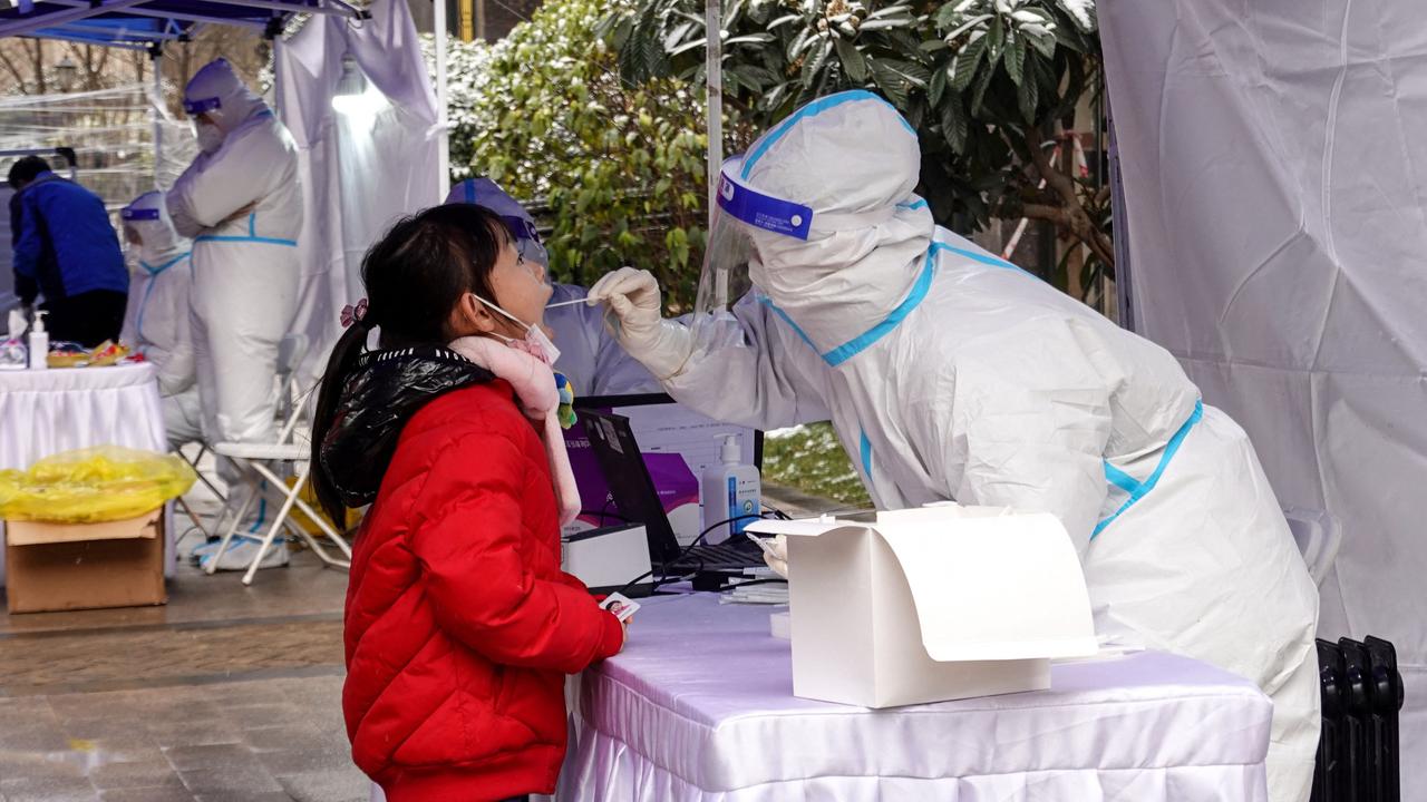 This photo taken on December 25, 2021 shows residents undergoing a nucleic acid test for the Covid-19 coronavirus in Xi'an in China's northern Shaanxi province. Picture: AFP/ China OUT