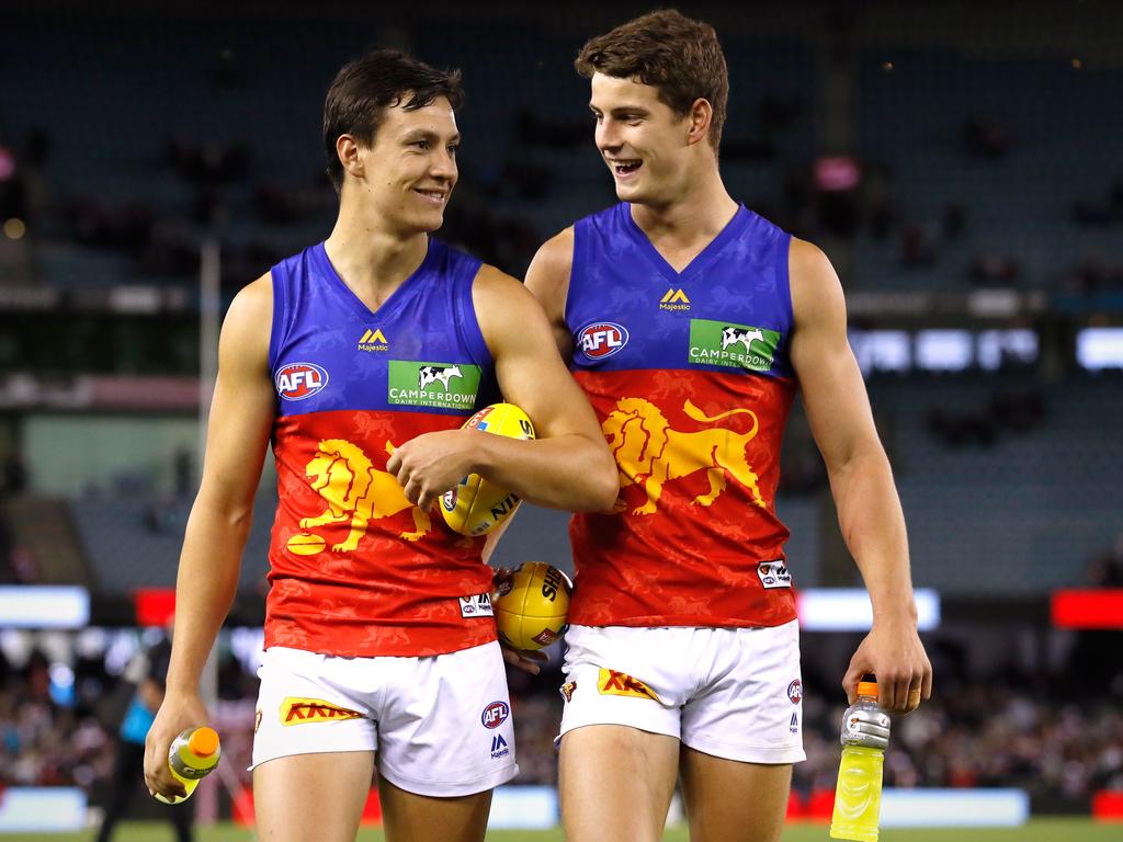 MELBOURNE, AUSTRALIA - APRIL 09: Debutantes and former North Ballarat Rebels teammates, Hugh McCluggage (left) and Jarrod Berry of the Lions chat after their AFL debuts during the 2017 AFL round 03 match between the St Kilda Saints and the Brisbane Lions at Etihad Stadium on April 09, 2017 in Melbourne, Australia. (Photo by Adam Trafford/AFL Media/Getty Images)