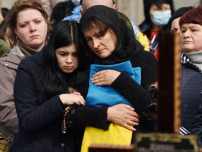 Mourners at the funeral of the soldier Teodor Osadchyi, one of thousands of Ukrainians killed during Russia’s invasion. Picture: AFP