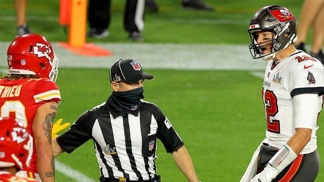 A referee separates Tyrann Mathieu and Tom Brady. Getty: Kevin C. Cox/Getty Images/AFP