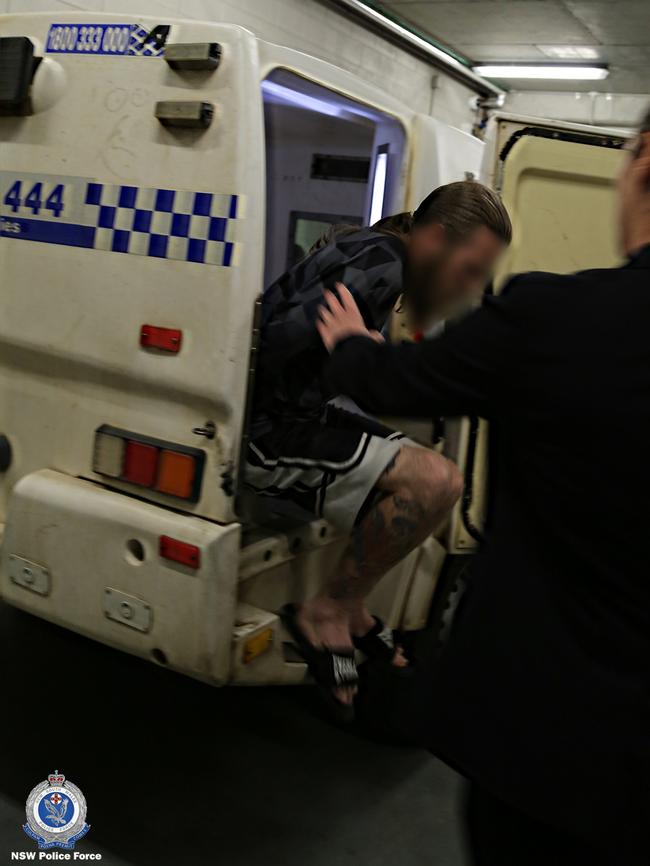 A man arrested over the alleged murder of Shane De Britt is taken to Orange Police Station. Picture: NSW Police