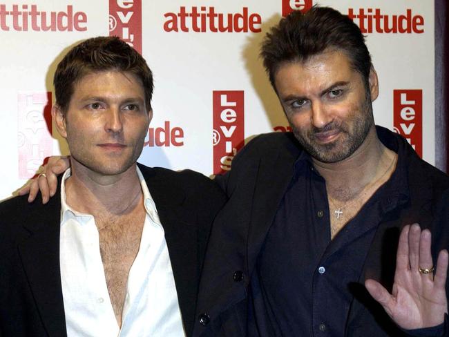 Singer George Michael (R) and his then partner Kenny Goss arrive for Attitude Magazine's 10th Birthday Party at the Atlantic Bar & Grill in central London in 2004. Picture: AP.