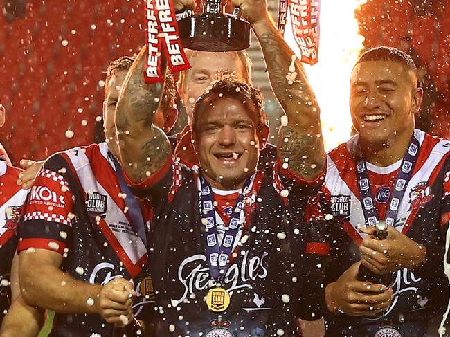 ST HELENS, ENGLAND - FEBRUARY 22: Jake Friend of Sydney Roosters lifts the Trophy after victory in the World Club Series Final between St Helens and Sydney Roosters at Totally Wicked Stadium on February 22, 2020 in St Helens, England. (Photo by Lewis Storey/Getty Images)