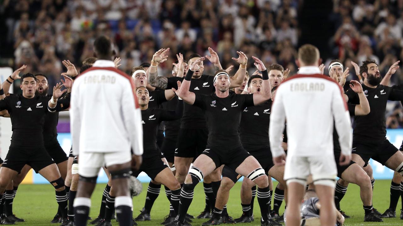 The England team watches as New Zealand performs the haka before the start of their Rugby World Cup semi-final at International Yokohama Stadium. (AP Photo/Aaron Favila)