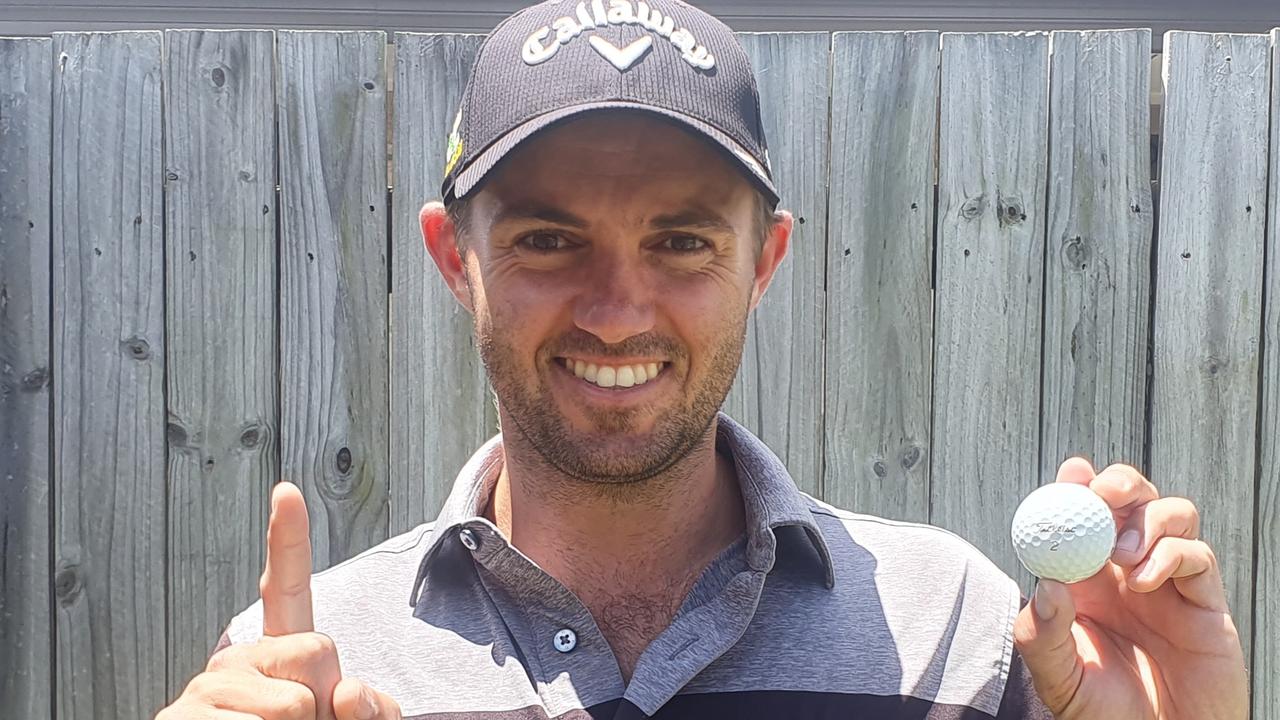 A proud Daniel Hall with the ball he used for a rare albatross.