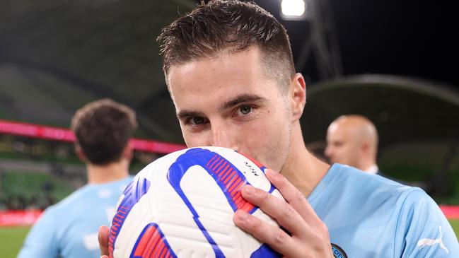 MELBOURNE, AUSTRALIA - APRIL 22: Jamie Maclaren of Melbourne City kisses the match ball after he scored a hat trick to becomes the league's highest goalscorer during the round 25 A-League Men's match between Western United and Melbourne City at AAMI Park, on April 22, 2023, in Melbourne, Australia. (Photo by Robert Cianflone/Getty Images)