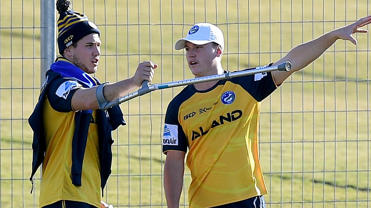 Mitchell Moses (left) and Jai Field of the Eels speak during a training session.