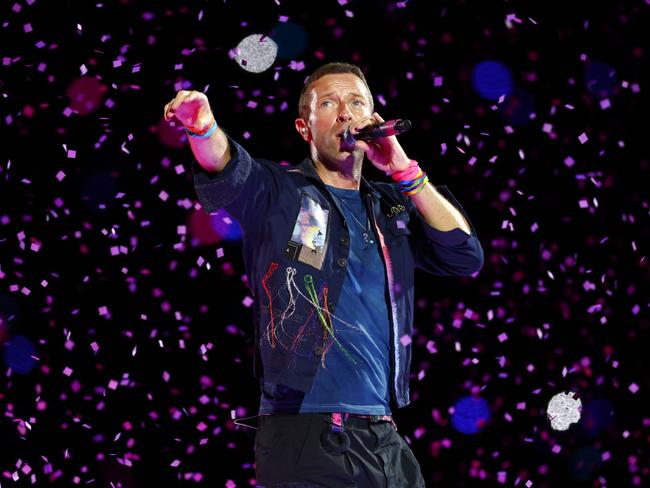 DAILY TELEGRAPH NOVEMBER 6, 2024. Chris Martin from Coldplay on stage at Accor Stadium at Sydney Olympic Park for their Music Of The Spheres World Tour concert. Picture: Jonathan Ng