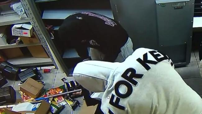 Masked intruders have broken into a Logan business twice in a matter of hours, threatening staff, smashing windows and stealing thousands of dollars worth of products. Picture: 9 News