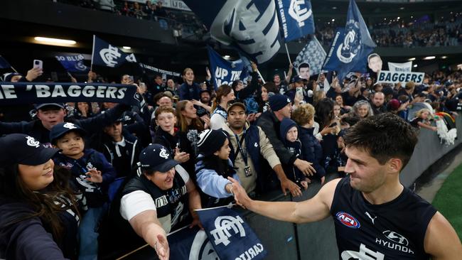 MELBOURNE, AUSTRALIA - APRIL 20: Nic Newman of the Blues celebrates with fans during the 2024 AFL Round 06 match between the Carlton Blues and the GWS GIANTS at Marvel Stadium on April 20, 2024 in Melbourne, Australia. (Photo by Michael Willson/AFL Photos via Getty Images)