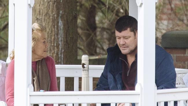 Ros and James Packer chat in privacy outside Wyman House at the McLean Hospital in Boston, where he has been undergoing treatment since March 22. Pictures: Angus Mordant