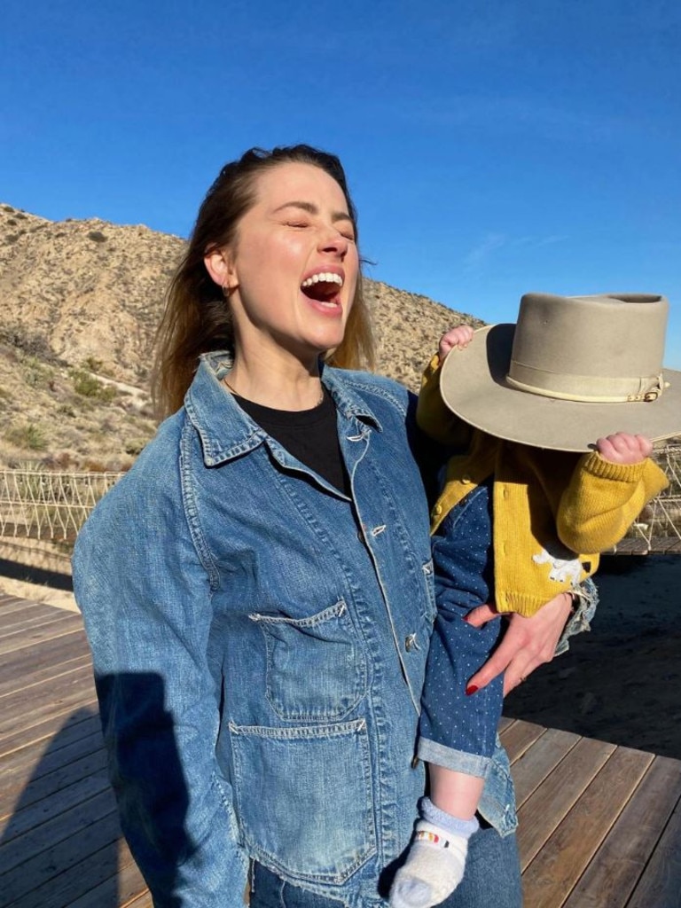 Amber Heard with her daughter Oonaugh Paige, posted to Insta on March 31. Heard secretly welcomed her baby girl via surrogate in July 2021. Heard now claims that she’s received violent threats urging her to “put my baby in the microwave.” Picture: amberheard/Instagram