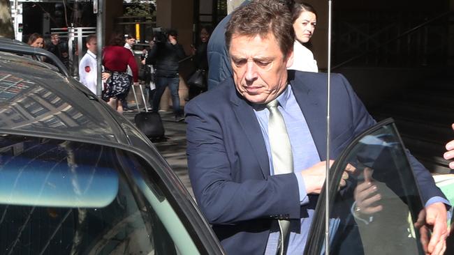 Former Essendon player and AFL coach Mark Thompson leaves the Melbourne Magistrate Court. Picture: AAP