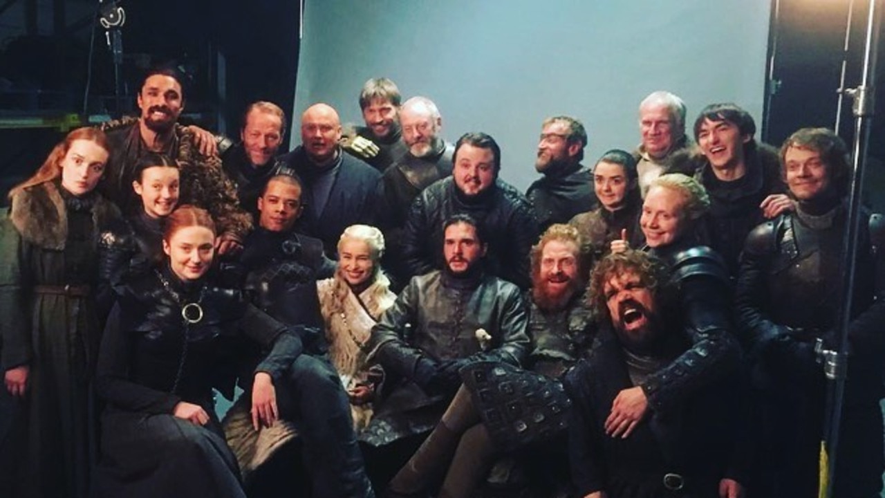 The Game of Thrones cast gather for a final episode picture.