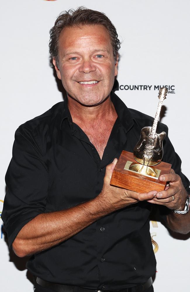 Troy Cassar-Daley poses with a Song of the Year Award at the Golden Guitar Awards during the 47th Tamworth Country Music Festival in Tamworth. Picture: AAP Image/Brendon Thorne.