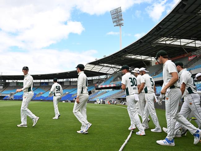 HOBART, AUSTRALIA - DECEMBER 07: Jordan Silk of the Tigers leads out the team during the Sheffield Shield match between Tasmania and South Australia at Blundstone Arena, on December 07, 2024, in Hobart, Australia. (Photo by Steve Bell/Getty Images)