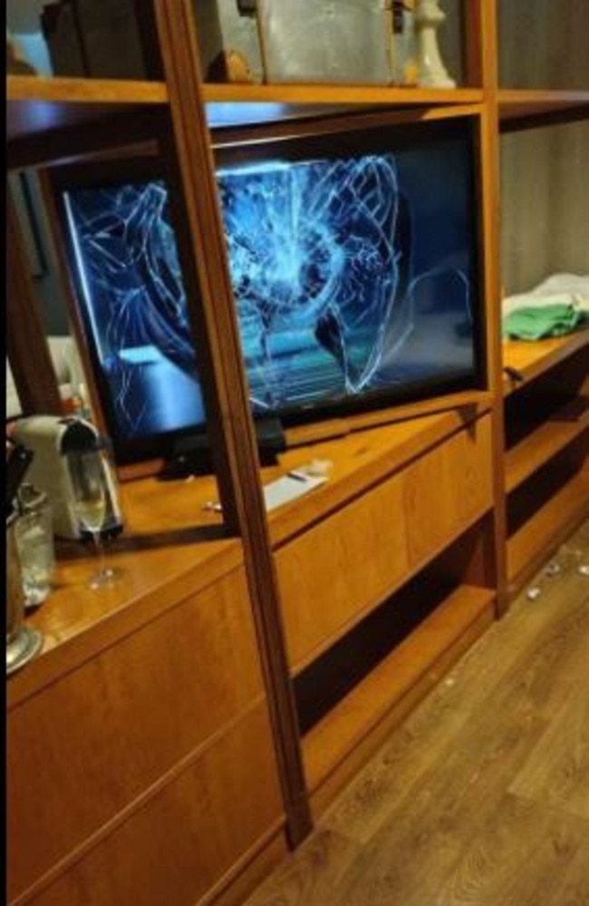 An LED television with a dent in its screen inside Liam Payne’s hotel room.