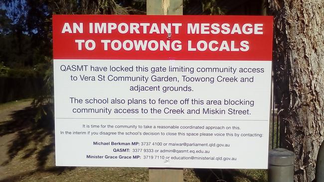 A sign warning locals about plans to fence off the QASMT oval.