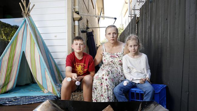 Harry, 13, Kirsty, and Tilly George, 9, were forced to extinguish their fire pit. Picture: AAP Image/Josh Woning