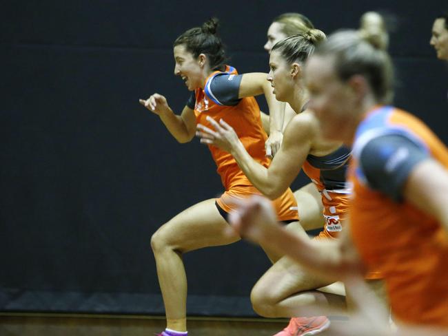 Netball friendly between the Giants (orange) and the Magpies (black) at Homebush.