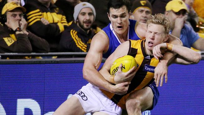 James Sicily gets tackled high. Picture: Colleen Petch.