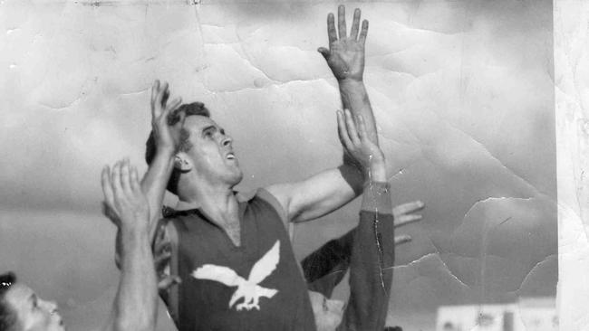 West Torrens Football Club legend and “checkside” punt master Lindsay Head going for the ball during a match on August 23, 1959. Photo The Advertiser.