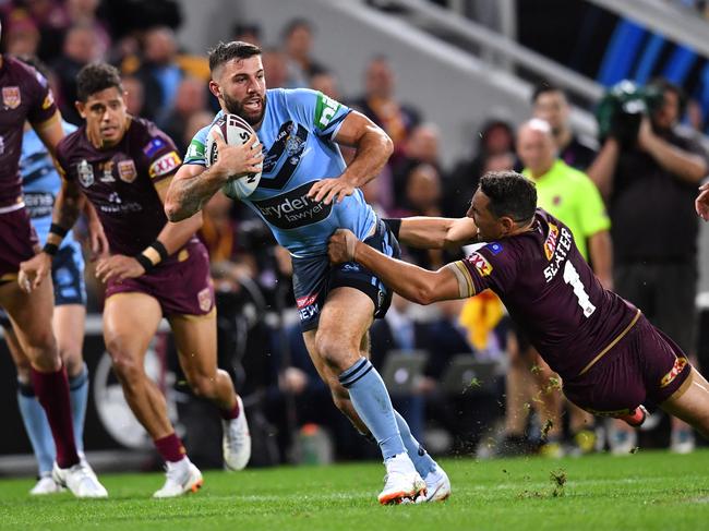 James Tedesco (left) of the Blues gets past Billy Slater (right) of the Maroons only for the play to be called back during Game 3 of the 2018 State of Origin series between the NSW Blues and the Queensland Maroons at Suncorp Stadium in Brisbane, Wednesday, July 11, 2018. (AAP Image/Darren England) NO ARCHIVING, EDITORIAL USE ONLY