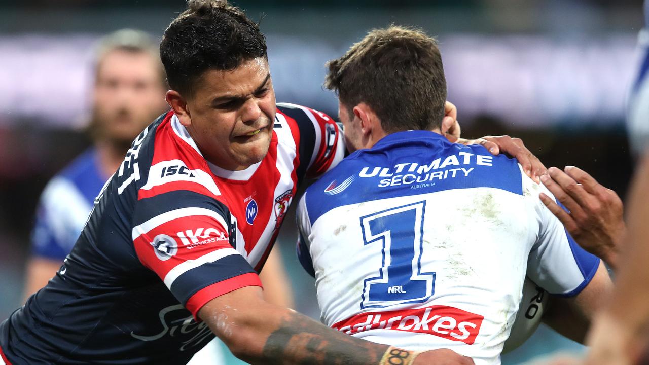 Roosters star Latrell Mitchell tackles Bulldog's Nick Meaney.