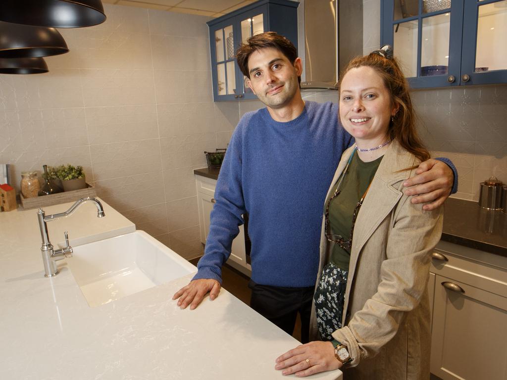 Nathan Burgess and his partner Jess Barry choose a kitchen at Simonds Homes display gallery in Melbourne. Picture: NCA NewsWire / David Geraghty