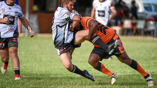 Miriam Vales Sebastion Carmichael gets tackled by Patrick Tanna. Picture: Brian Cassidy