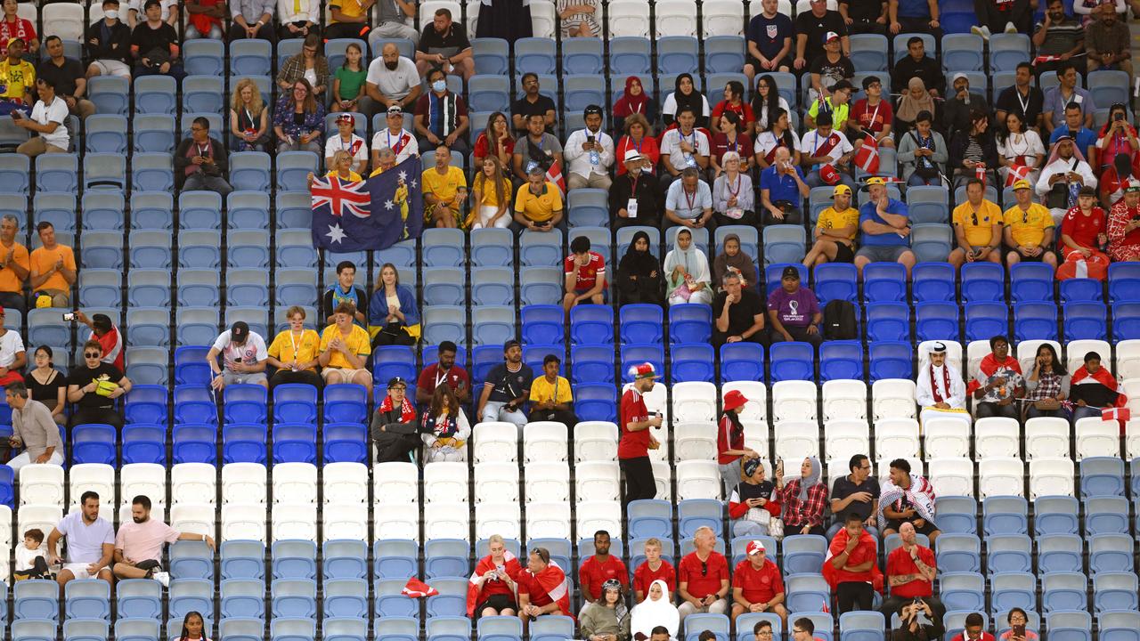 Empty seats are seen among the crowd. (Photo by NICOLAS TUCAT / AFP)