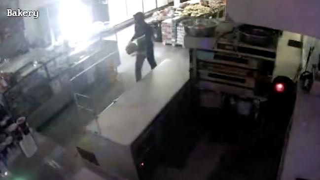 CCTV footage has been released of a man allegedly dousing a business with accellerant. picture : Victoria Police