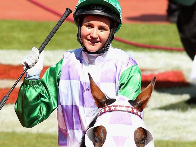 MELBOURNE, AUSTRALIA - NOVEMBER 03: Michelle Payne riding Prince of Penzance celebrates winning race 7, the Emirates melbourne Cup on Melbourne Cup Day at Flemington Racecourse on November 3, 2015 in Melbourne, Australia. (Photo by Quinn Rooney/Getty Images)