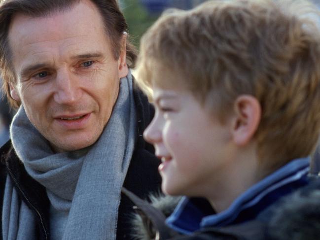 Actors Liam Neeson (L) and Thomas Sangster in 2003 film 'Love Actually'.