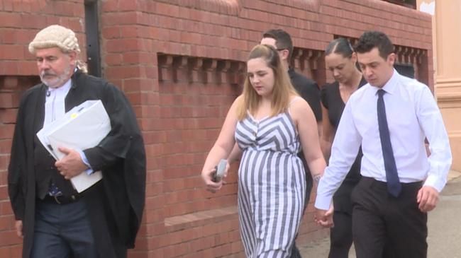 Joshua Aaron Byrne (right), 21, walks with family to court behind defence barrister Michael King. Picture: Rory Dudley/9 News Riverina