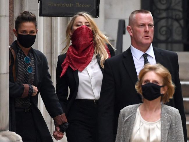 Amber Heard and her girlfriend Bianca Butti leave the UK’s Royal Courts of Justice. Picture: Getty Images