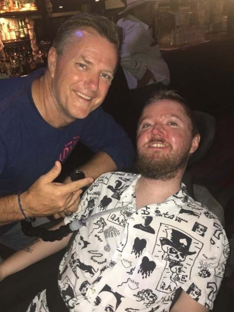 Toowoomba man with Duchenne muscular dystrophy Mitchell Fletcher, pictured here with dad David, has been remembered as a "warrior" who wouldn't let his severe condition stop him from living life.