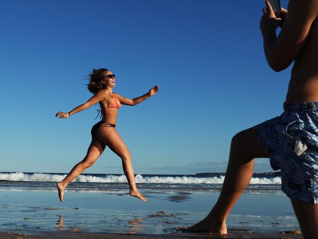 American tourist Sarah Paterson, 20 enjoying Sydney's warm winter at Bondi. Picture. Phil Hillyard