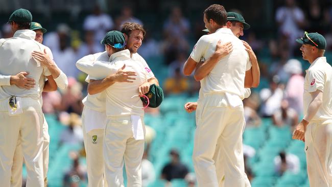 Australian players celebrate after securing victory in the fifth Ashes Test at the SCG on Monday.