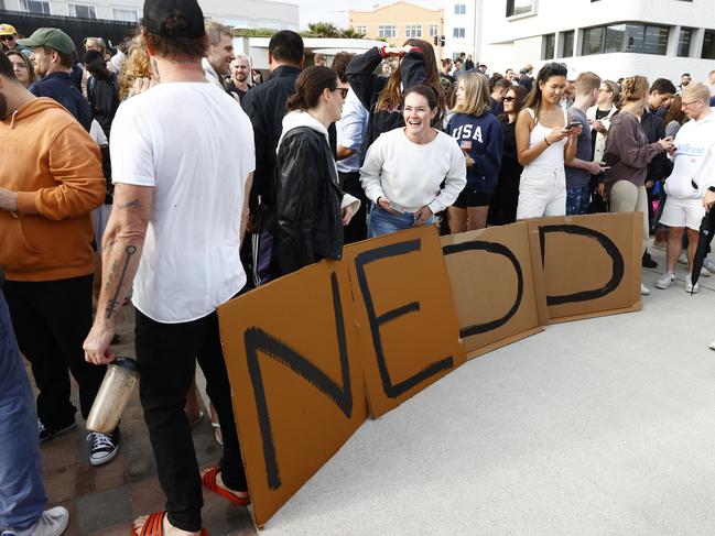 Supporters cheered him on with handmade signs. Picture: Richard Dobson