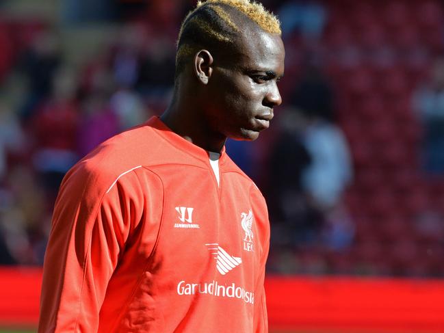 Liverpool's Italian striker Mario Balotelli, dropped to the bench today, is seen before the English Premier League football match between Liverpool and West Bromwich Albion at Anfield in Liverpool, north west England on October 4, 2014. AFP PHOTO / PAUL ELLIS RESTRICTED TO EDITORIAL USE. No use with unauthorized audio, video, data, fixture lists, club/league logos or “live” services. Online in-match use limited to 45 images, no video emulation. No use in betting, games or single club/league/player publications.