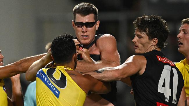 MELBOURNE, AUSTRALIA - FEBRUARY 27: Marlion Pickett of the Tigers and Mason Cox of the Magpies wrestle during the 2024 AFL Community Series match between Collingwood Magpies and Richmond Tigers at Ikon Park on February 27, 2024 in Melbourne, Australia. (Photo by Quinn Rooney/Getty Images)