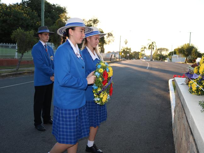 College Captains, Bree-Anna Meehan and Jasmine Thompson laying wreath at Cenotaph.