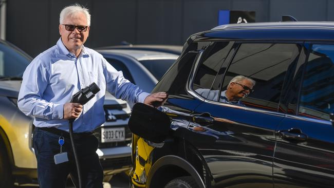 Mitsubishi Motors Australia president and chief executive officer Shaun Westcott with bidirectional car charger – that enables a car battery to power homes and also can charge cars. Picture: RoyVphotography