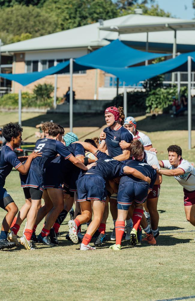 Jack Henry (red headgear) in the rolling maul for Canterbury College.