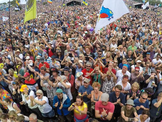 FILE PHOTO: GLASTONBURY, ENGLAND - MARCH 18: Glastonbury Festival 2020 has been postponed due to the coronavirus pandemic. GLASTONBURY, ENGLAND - JUNE 25:  People watch Barry Gibb perform on the main Pyramid Stage at the Glastonbury Festival site at Worthy Farm in Pilton on June 25, 2017 near Glastonbury, England. Glastonbury Festival of Contemporary Performing Arts is the largest greenfield festival in the world. It was started by Michael Eavis in 1970 when several hundred hippies paid just Â£1, and now attracts more than 175,000 people.  (Photo by Matt Cardy/Getty Images)