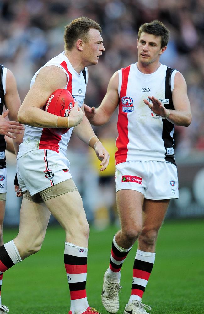 Andrew McQualter speaks to Brendon Goddard during the drawn Grand Final in 2010.